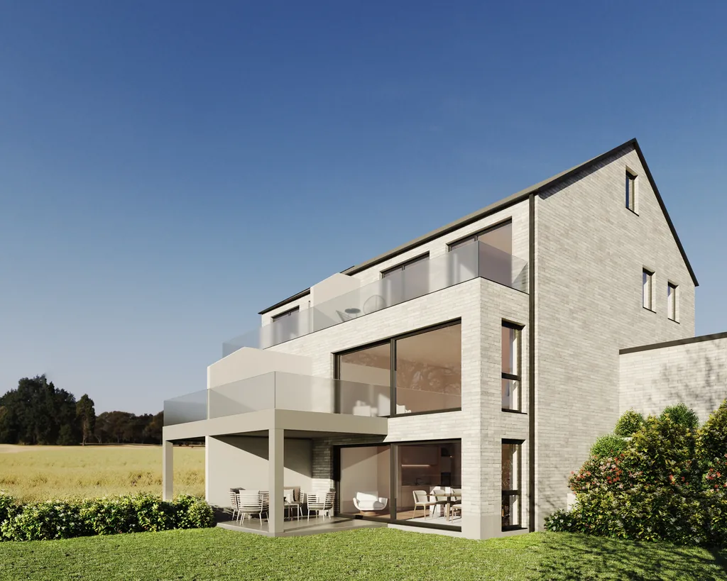 Doppelhaus in Heiligendorf mit heller Klinkerfassade, Dachterrasse und großen Glasflächen