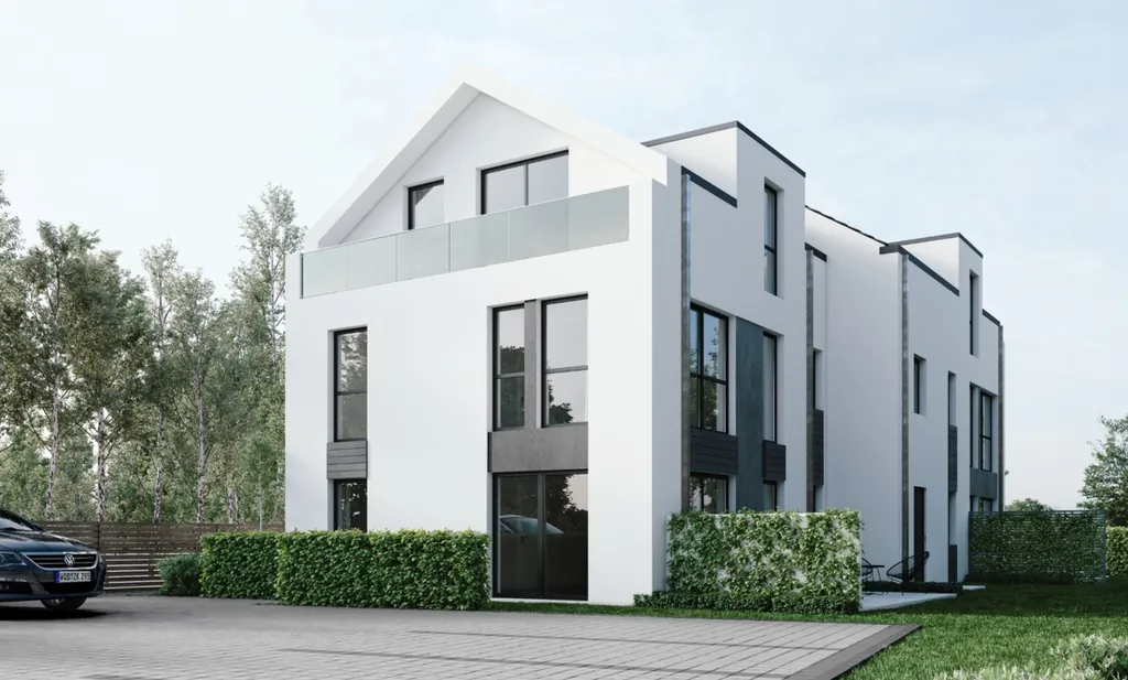 Mehrfamilienhaus in Rötgesbüttel mit weißer Fassade und Satteldach
